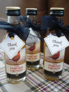 Miniature whiskeys for the Gents decorated with black ribbon & thankyou tag